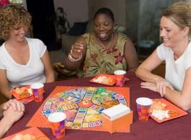 women playing a board game