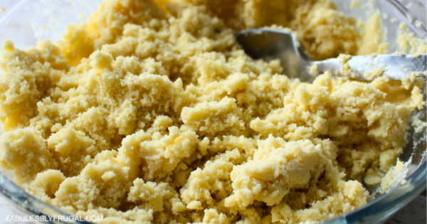 ingredients for no roll pie crust mixed together in a glass pie plate