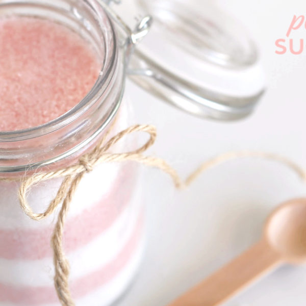 Jar filled with layered candy cane sugar scrub