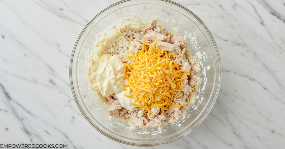 mixing the casserole sauce and cheese