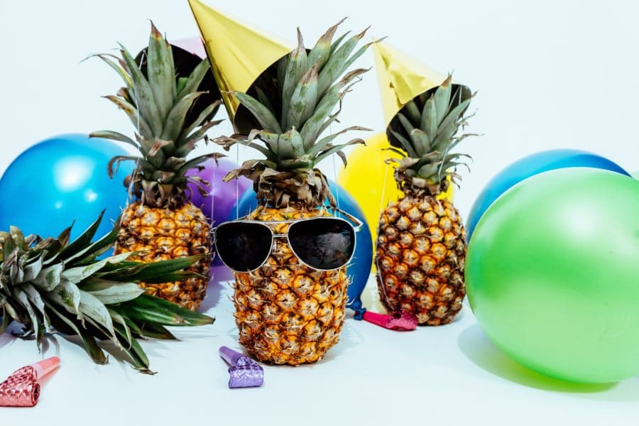 Pineapples in front of birthday equipment