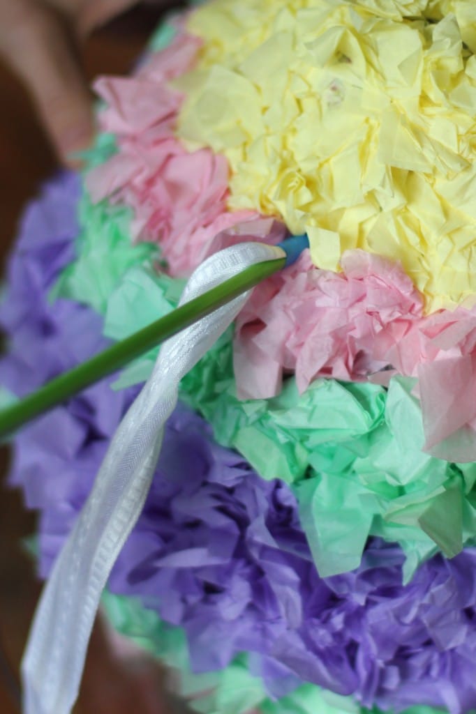 Adding a rope to the easter pinata