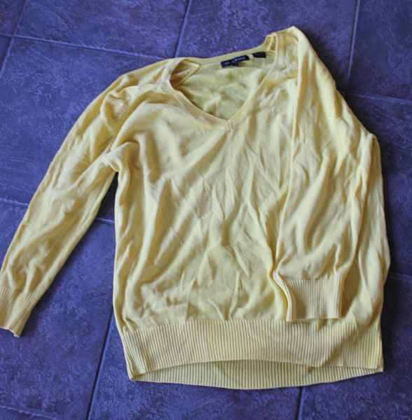 Yellow sweater after using DIY clothes whitener