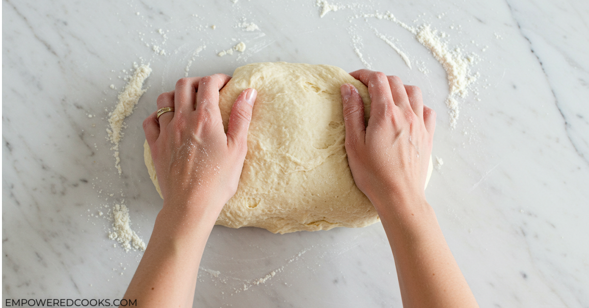 kneading pizza dough