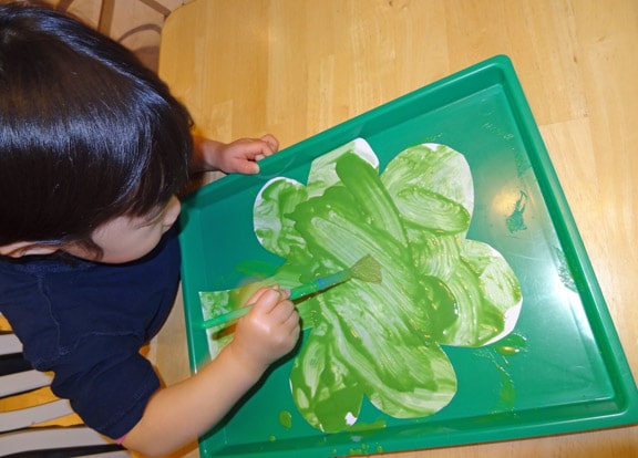 Child Painting a fizzing shamrock