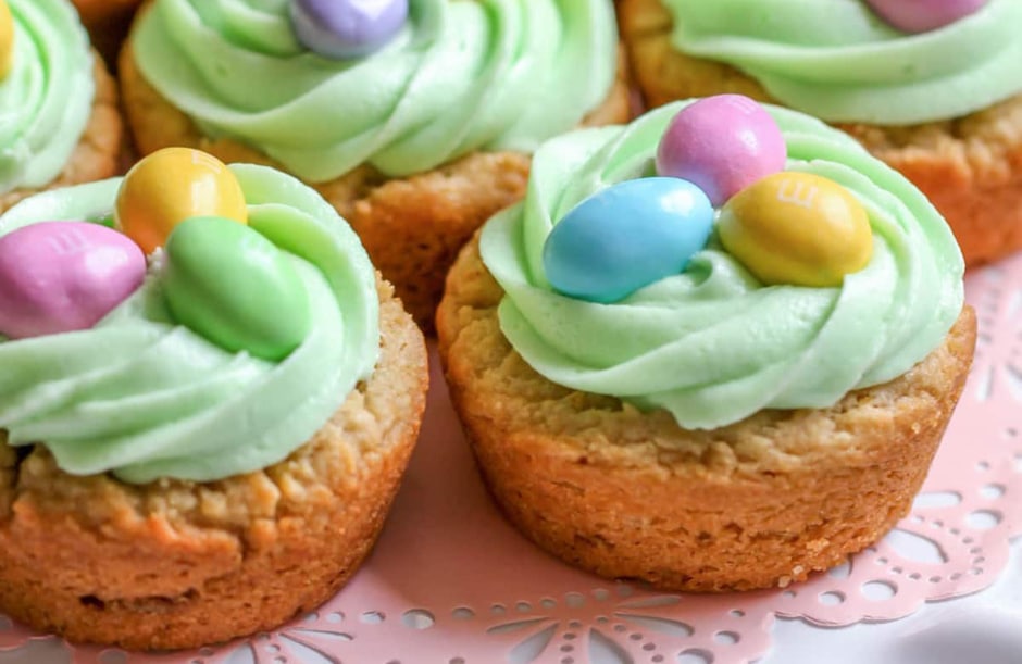 Cookie cups with green frosting and eggs on top