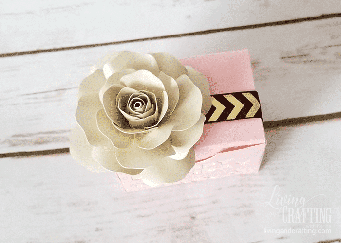 Mini white paper rose on gift box