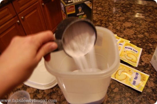 Adding homemade dishwasher detergent ingredients to container