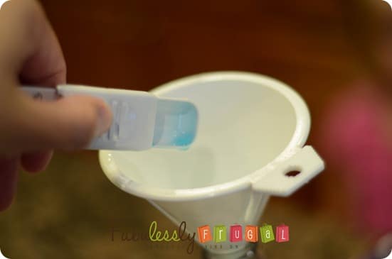 Adding the dishsoap to the diy all purpose cleaner