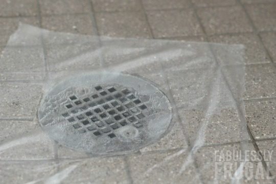 covering shower drain with plastic
