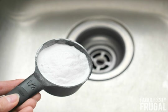 Cup of baking soda over drain
