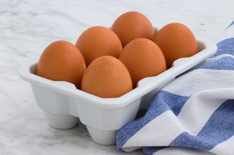 Six raw eggs in tray