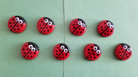 Bottle caps painted as ladybugs