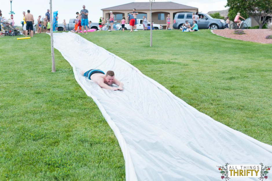 Extra large slip and slide with person sliding down