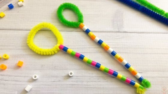 Green and yellow pipe cleaner bubble wands