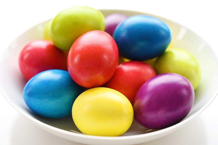 Bowl of multi-colored glossy Easter eggs