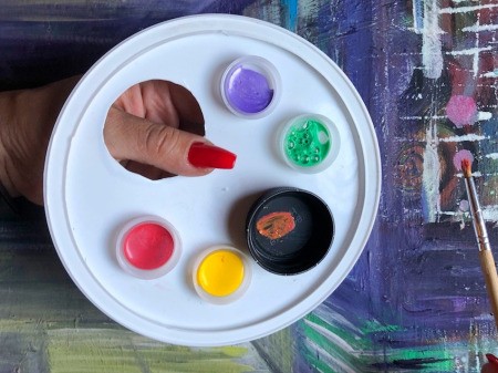 Paint palette made with caps and lids