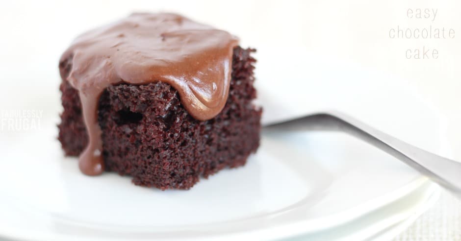 Small square of chocolate cake with melting frosting on top