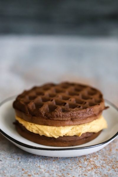 Peanut butter filling squished between two chocolate chaffles