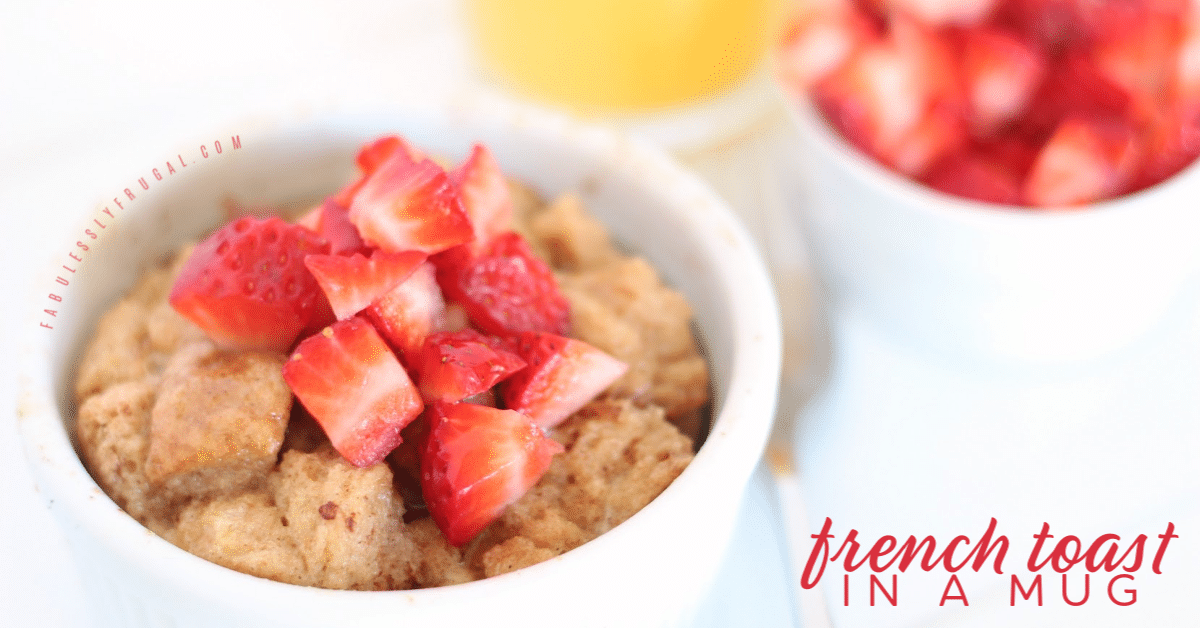 Mug of french toast with strawberries on top