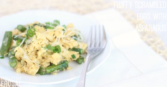 Plate of scrambled eggs with asparagus