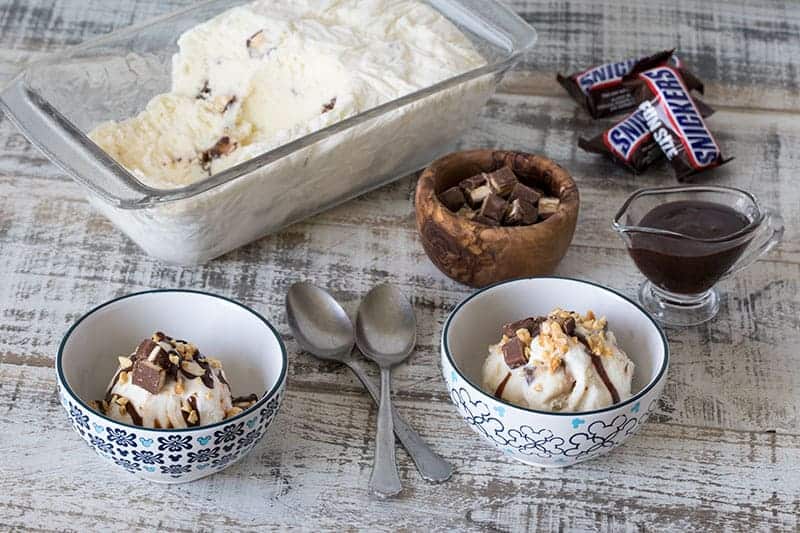 Finished Snickers ice cream next to ingredients