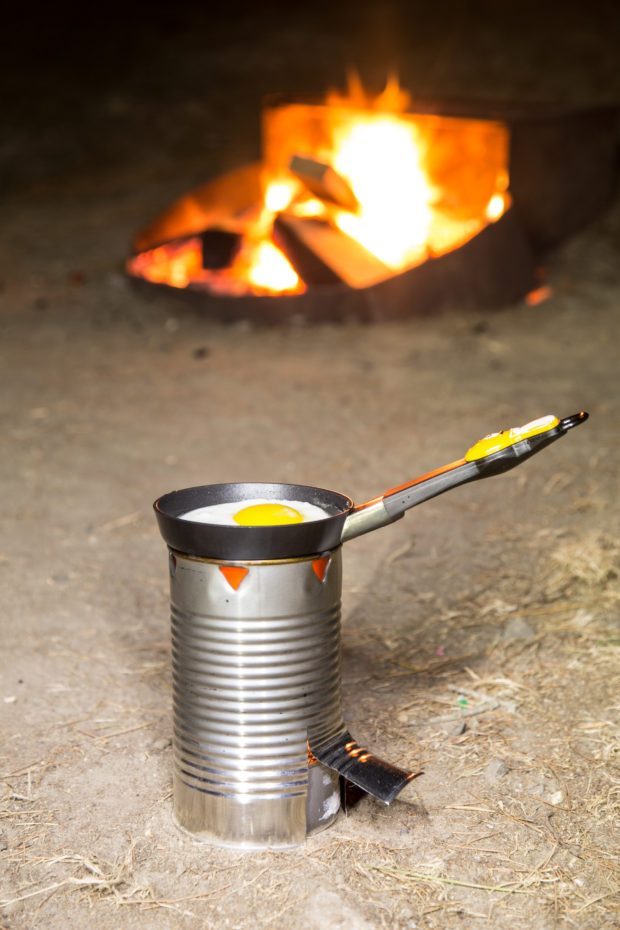 Tin can stove cooking an egg