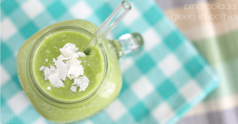 Green pina colada smoothie with coconut shavings on top