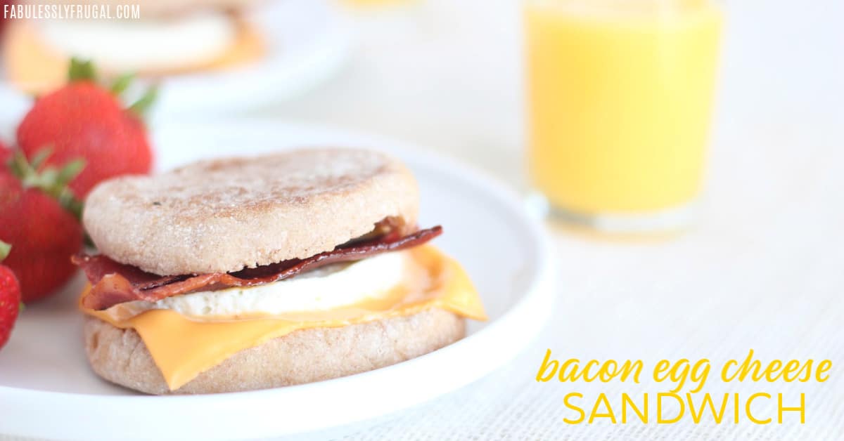 Breakfast sandwich with glass of orange juice