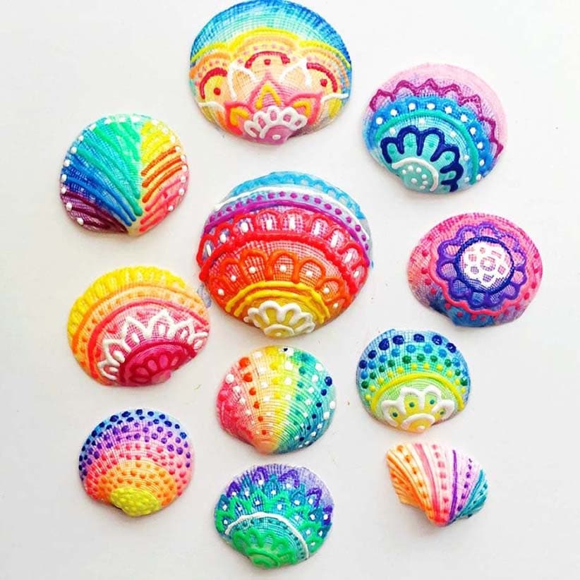 Colorful seashells painted with puff paint