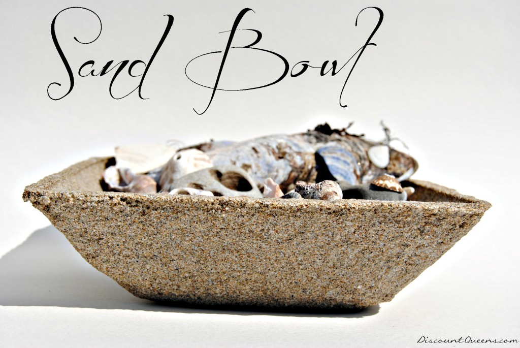 Sand bowl with beach items in it