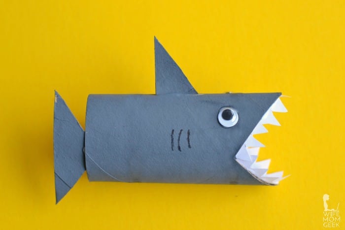 Toilet roll shark on yellow background