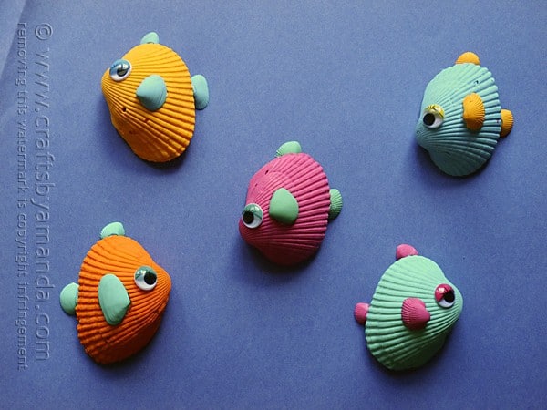 Colorful painted seashells turned into fish