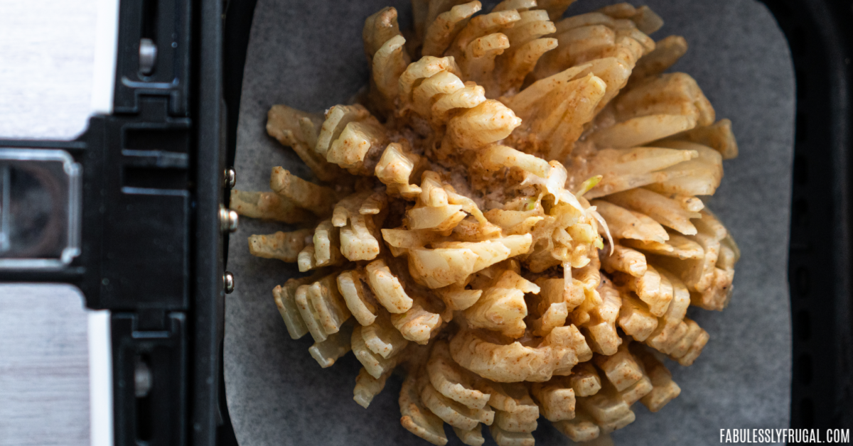 https://fabulesslyfrugal.com/wp-content/uploads/2021/06/how-to-make-a-bloomin-onion-in-the-air-fryer-5.png