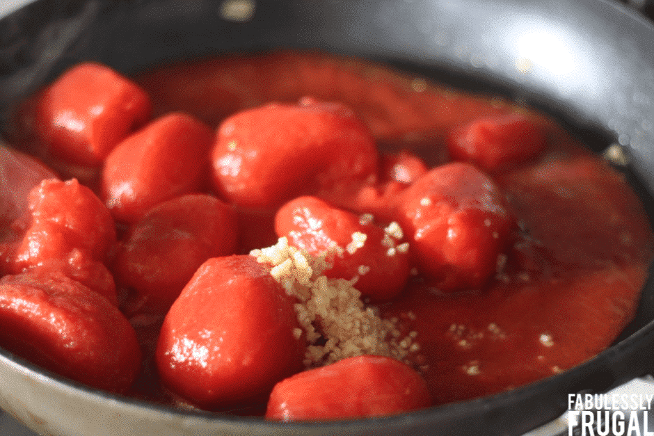 Sauteing whole tomatoes with garlic