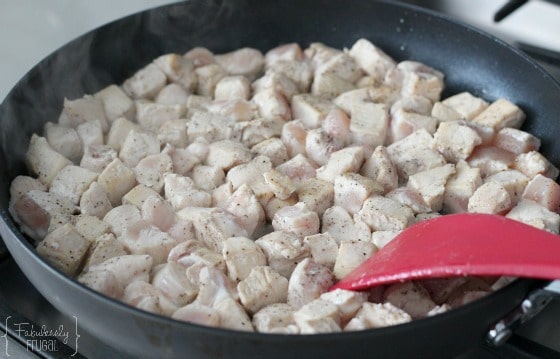 browning chicken in skillet for lemon glazed chicken