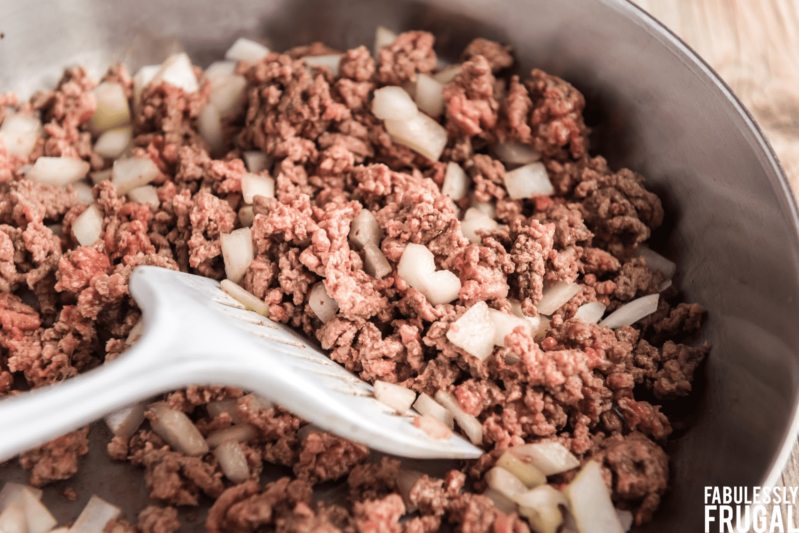 Browning ground beef with onion