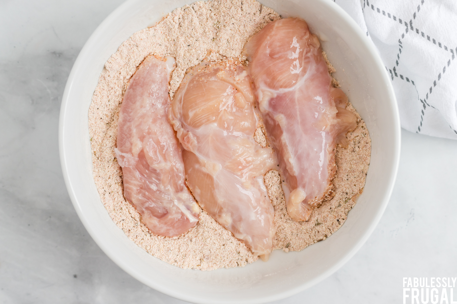 dipping chicken tenders in breading