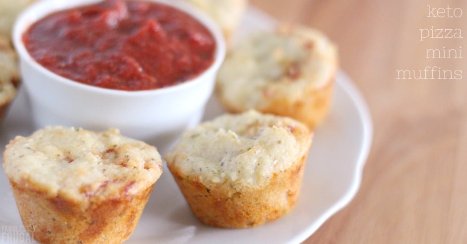Low carb pizza muffins on a plate with some dip in the middle