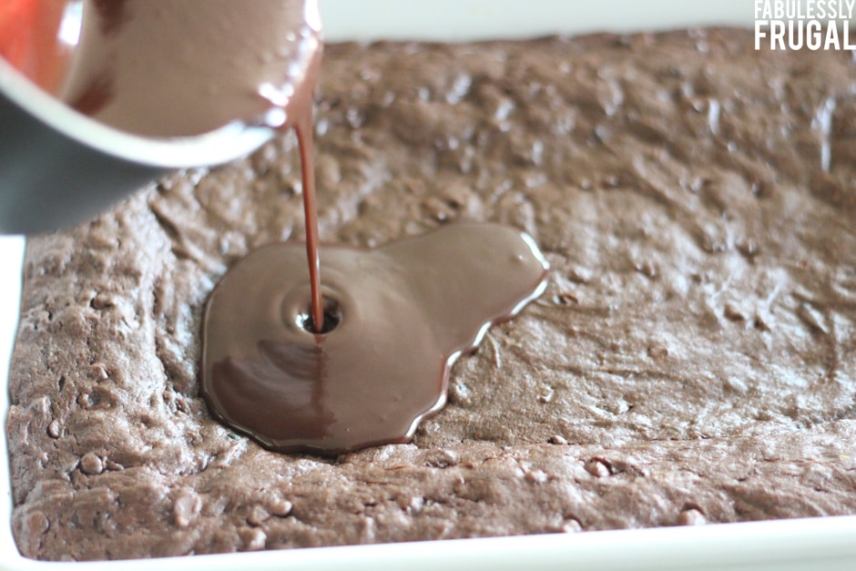 Adding chocolate frosting