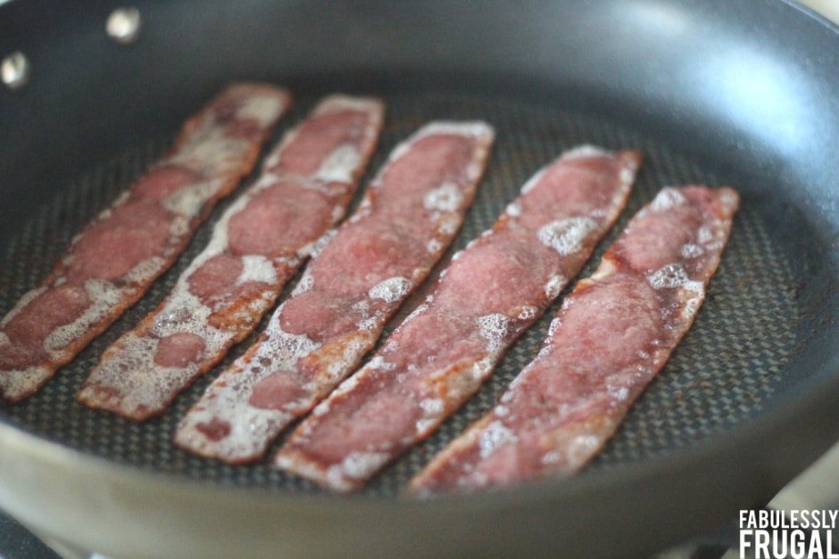 Bacon sizzling on pan