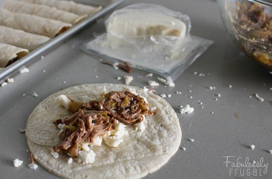 shredded beef taquitos with queso fresco