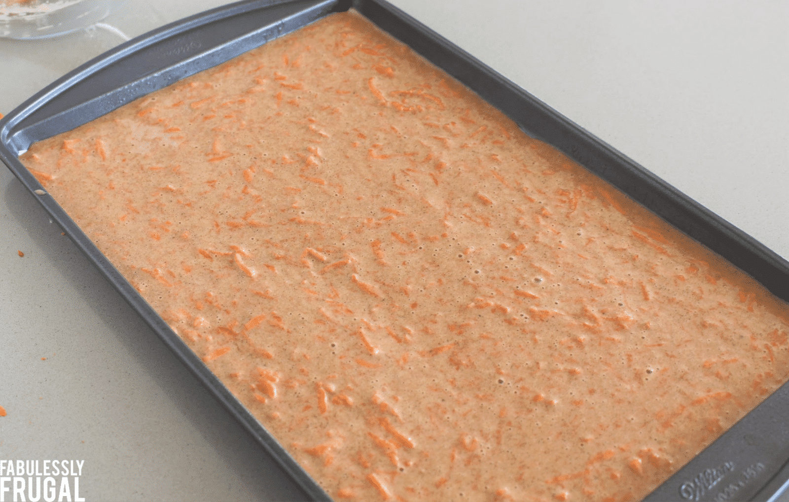 Carrot cake batter in jelly roll pan