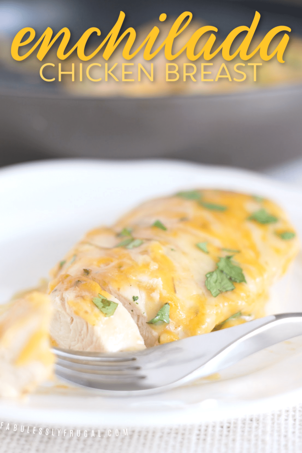 Cut open chicken breast with enchilada sauce