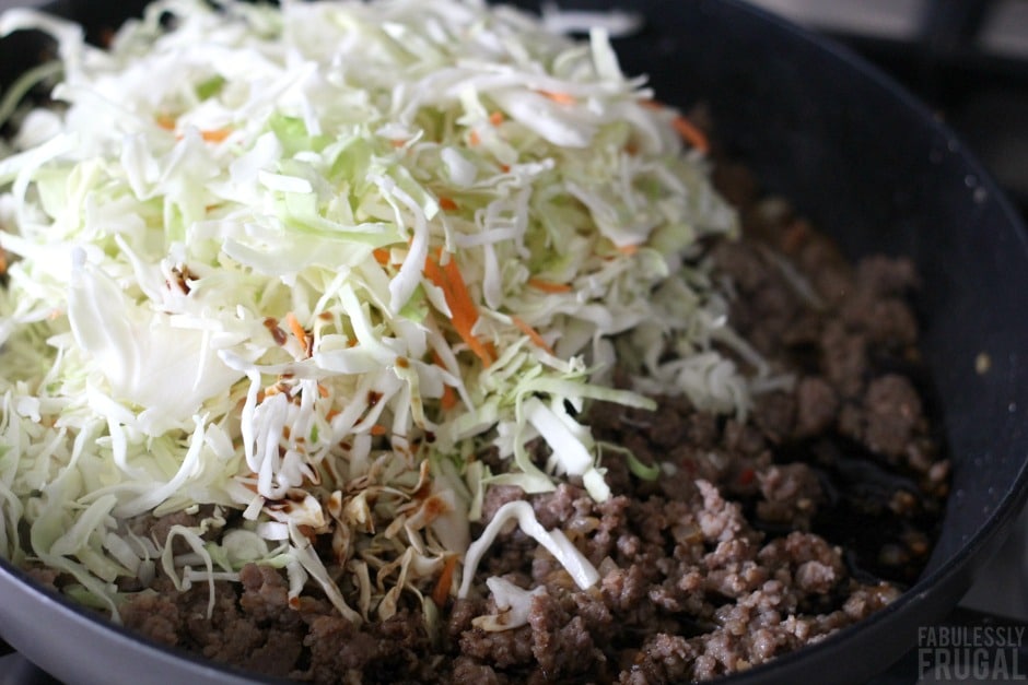 coleslaw mix and ground sausage for egg roll in a bowl