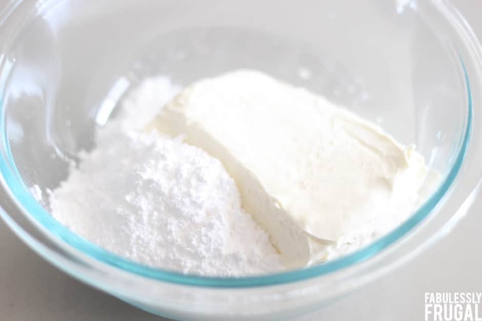 Cream cheese filling ingredients in glass mixing bowl