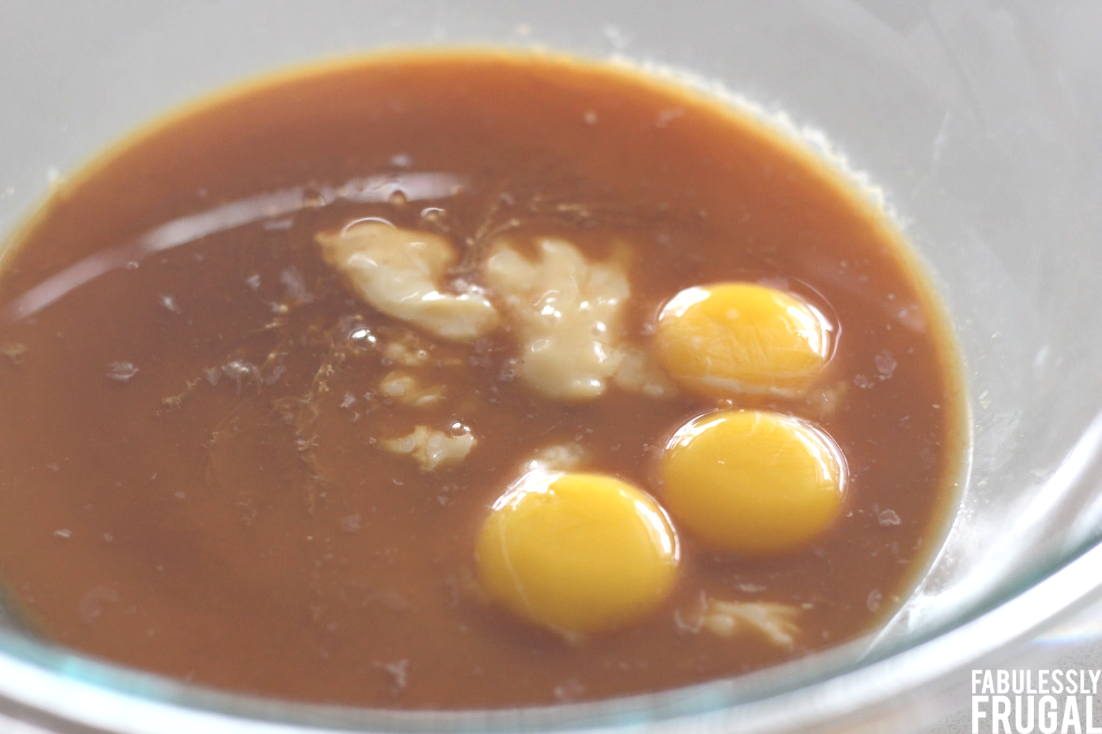 Egg yolks and other ingredients in mixing bowl
