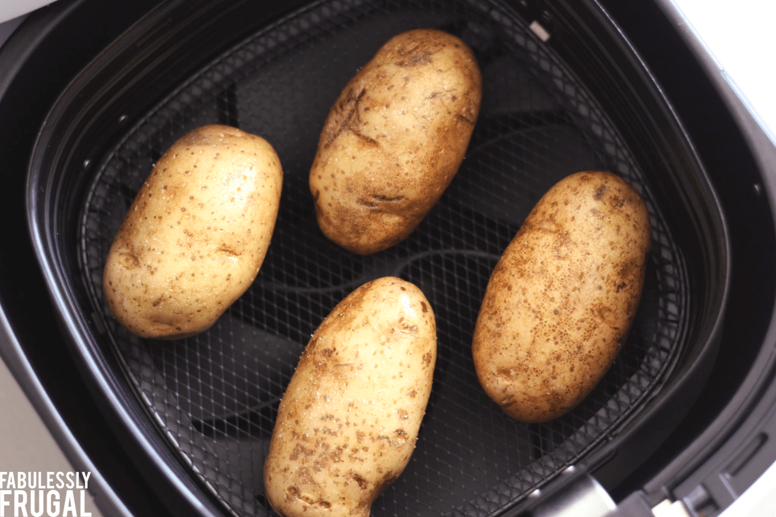 Four baked potatoes in air fryer 