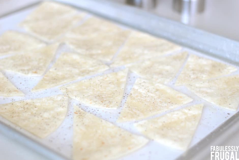 Homemade tortilla chips on baking sheet
