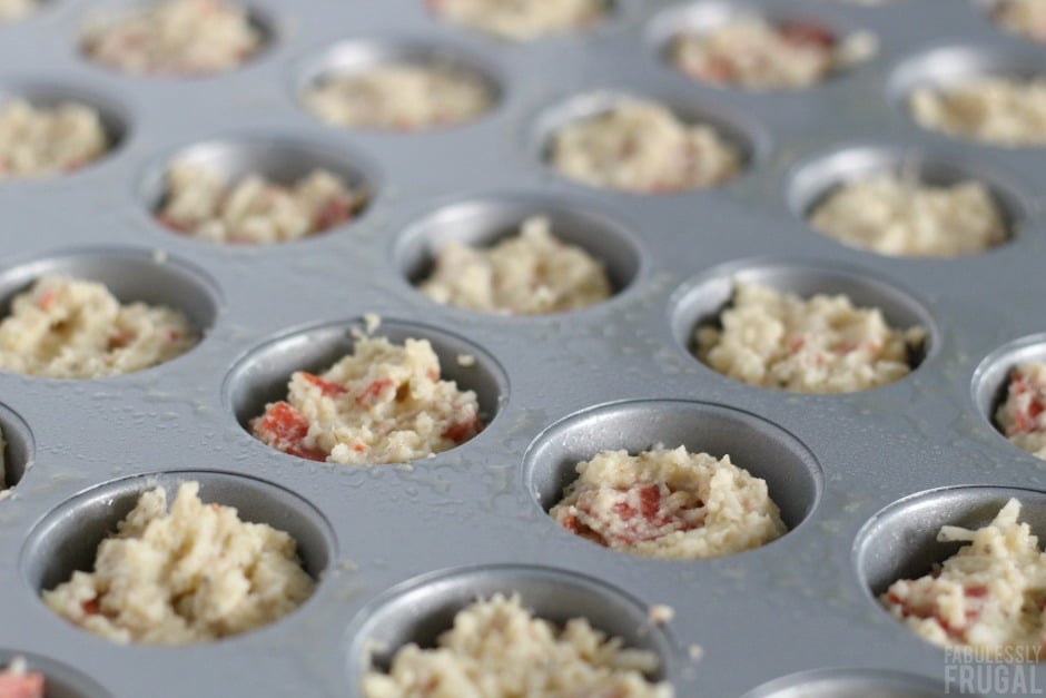 Low carb pizza muffins in the muffin pan getting ready for being baked